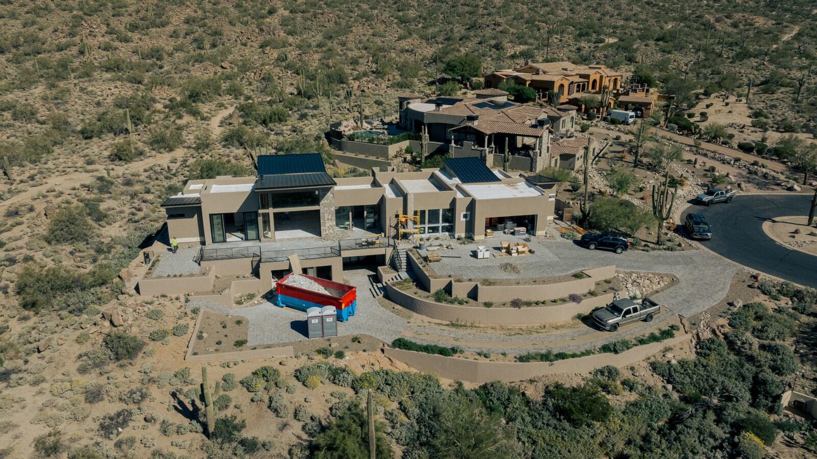 Aerial view of a hillside custom home built by Kogan LLC in the Arizona desert