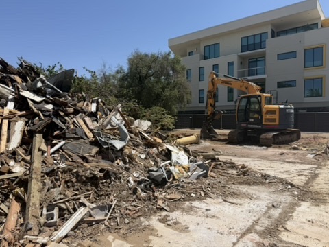 Sorted demolition debris piled for haul-off