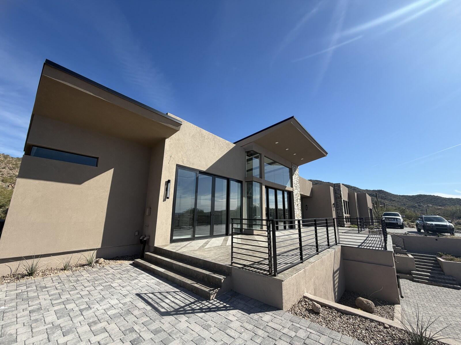 The glass frontage of a desert home built by Kogan LLC near Mesa, Arizona