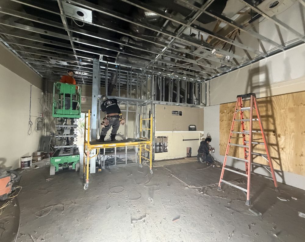 Kogan crew stripping a commercial interior down to the structure